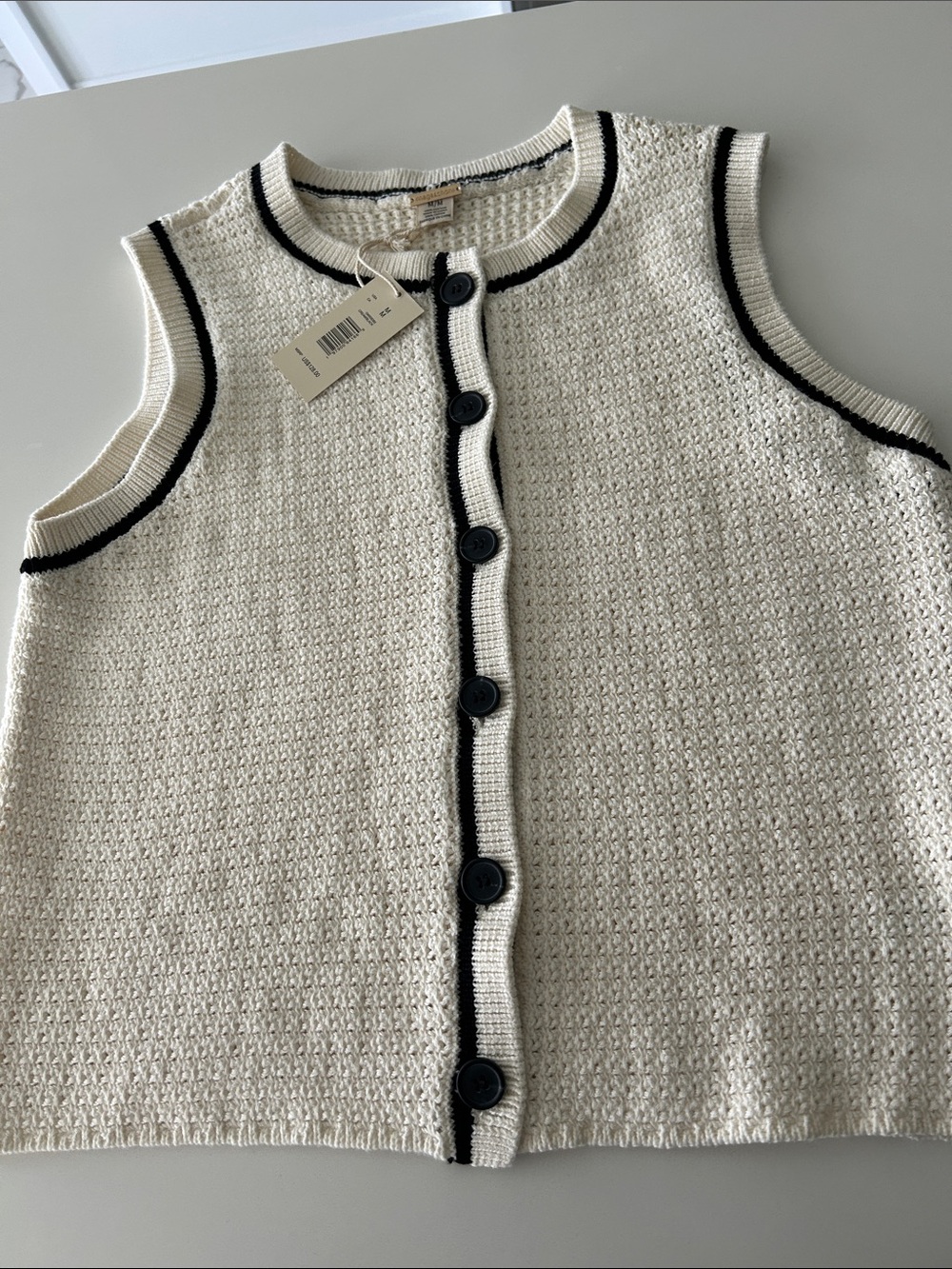 Magaschoni Cream Sleeveless Knit Cardigan with Black Trim and Buttons